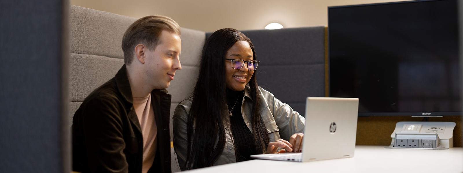 Two students sat at table