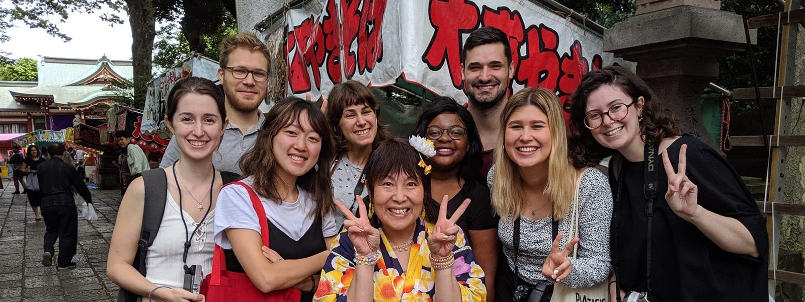 Students posing for a group photo in Japan