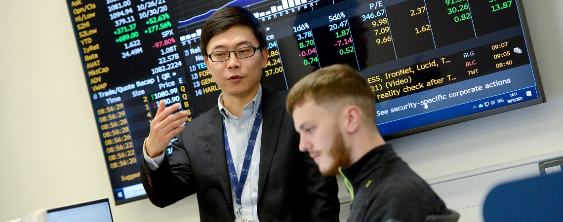 A student and lecturer discussing work in the Blommber lab