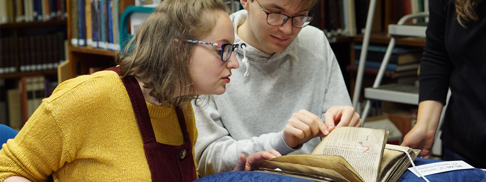 Students examining an historic text
