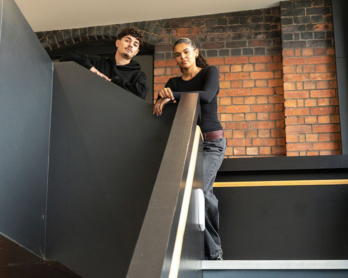 Two students on library stairs