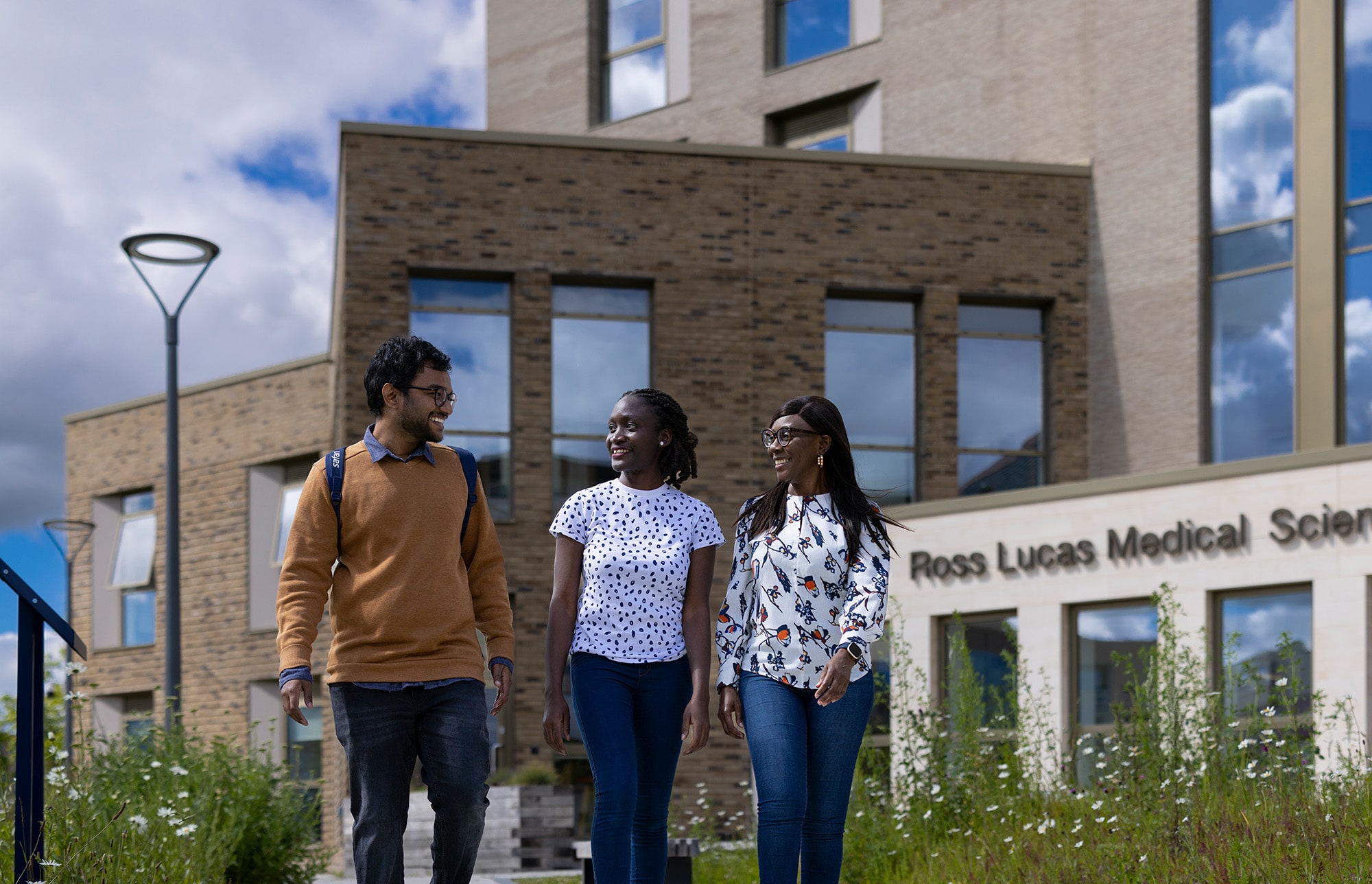 Three students by the Medical School